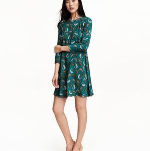 Turquoise dress with chameleon pattern